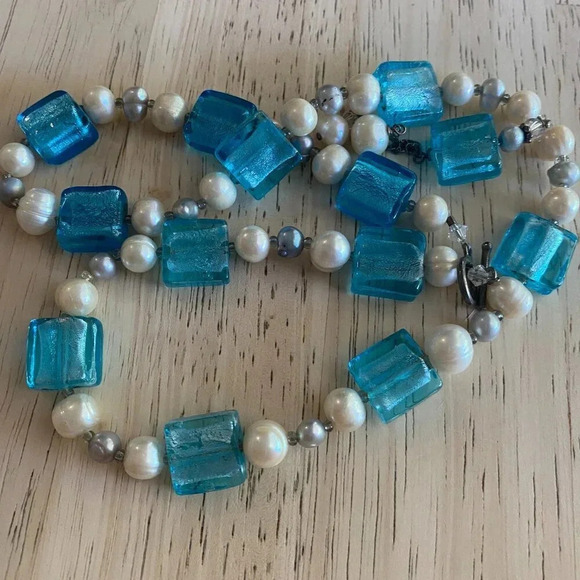 This necklace and earring set features aqua blue molded glass beads and a pearl— - Picture 4 of 5